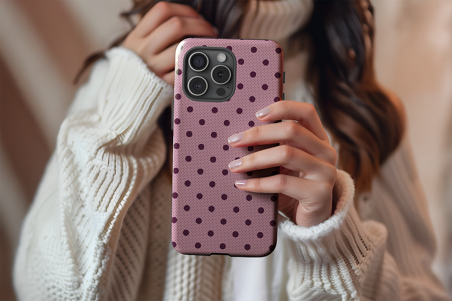 A cute girl holding our Burgundy Spot design phone case